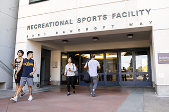 students walking outside of the recreational sports facility rsf